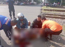 Pemotor di Surabaya Terjatuh saat Coba Terobos Palang Pintu Kereta Api