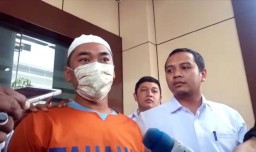 Berbaju Tahanan, PNS Kecamatan Tambaksari Tersangka Rasisme Minta Maaf